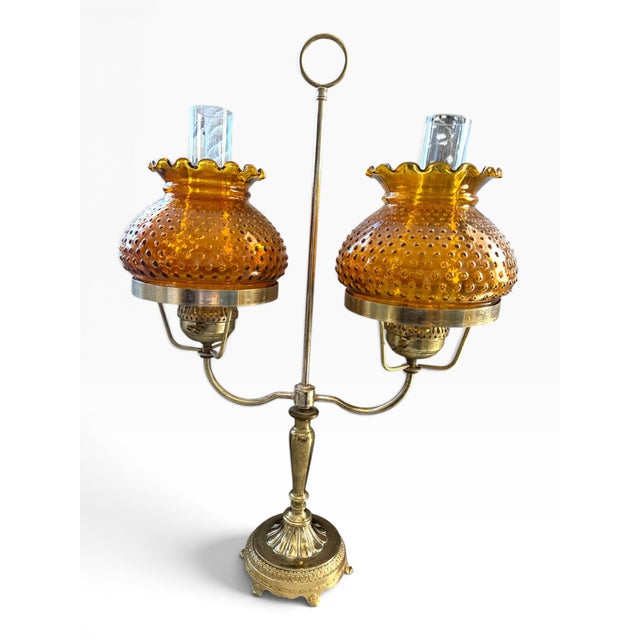 Striking large vintage twin-arm table lamp inspired by the form of a classic antique oil or hurricane lamp. This highly...