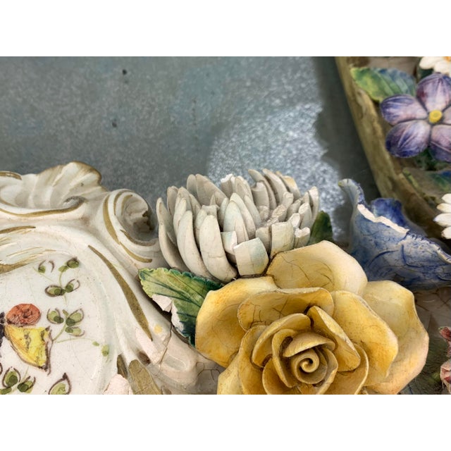 Vintage Italian Painted Ceramic Mirror with handmade delicate flower motif. Antique glass mirror surrounded by boutique of...