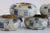 Set of five napkin rings with a wraparound checkerboard design in calming ocean blues crafted from genuine mother of pearl...