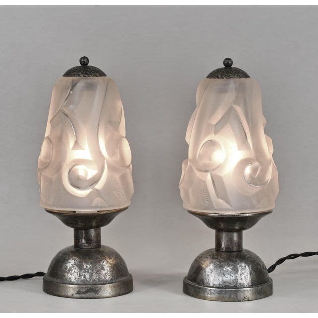 Degué A wonderful pair of French art deco lamps made around 1925-1930. The hammered cast iron bases hold signed shades in...