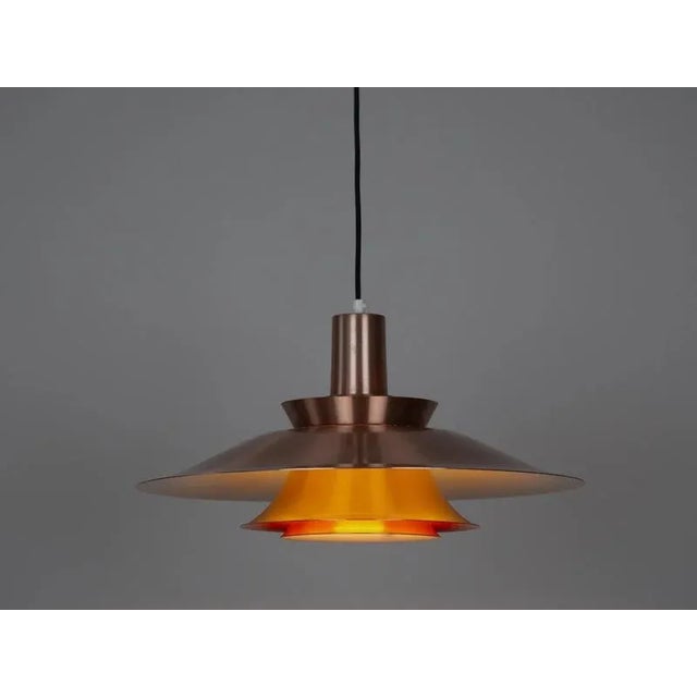 Aluminum Lyskaer lamp from the 1980s. The lamp's form was designed based on the principle of a reflective system that...