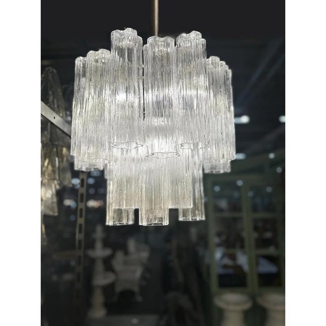 Contemporary sparkling murano glass “tronchi” chandelier .the texture "corteccia" in venini style give it sparkling also...