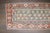 an early 20th century Persian Kurd Mini size rug featuring a boteh design