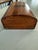 This vintage wooden jewelry box features a beautiful brass ships wheel and anchor inlay on the lid, adding a nautical...