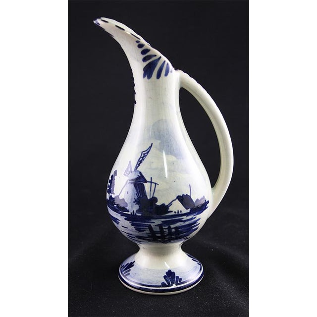 Add something blue-white to your collection with this small Delft pitcher from the Netherlands(Holland). Hand-painted with...