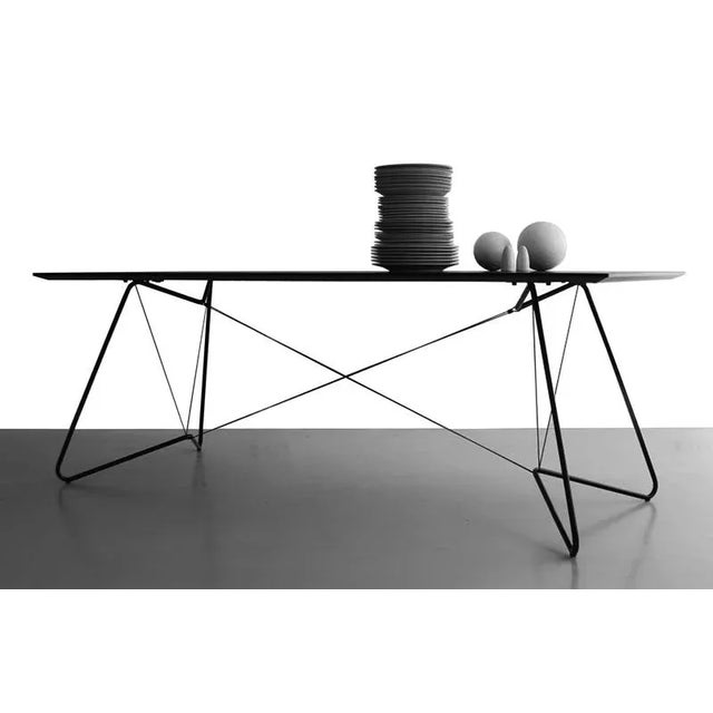 Black oas table 200 by ok design dimensions: d 90 x w 200 x h 74 cm. Materials: powder-coated metal, laminated mdf, paracord.
