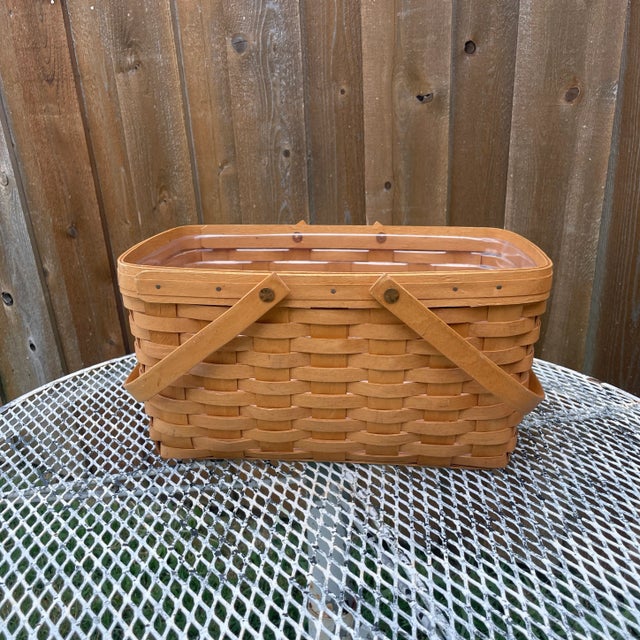 Longaberger 1996 Large Hand Woven Market Basket w/swing handles. Original plastic liner included. 13.5"H with handles up....