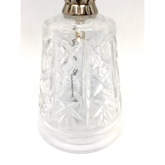 Very pretty crystal bell with a crystal ball inside making a lovely sound. When sitting on a surface, the ball doesn’t...