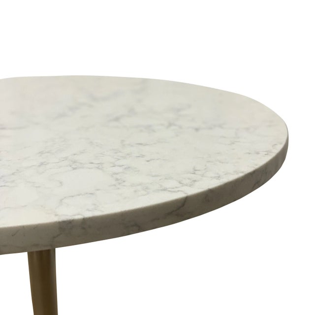 Simple and functional, the timeless design of this side table demonstrates refined features with a top made of quartz and...