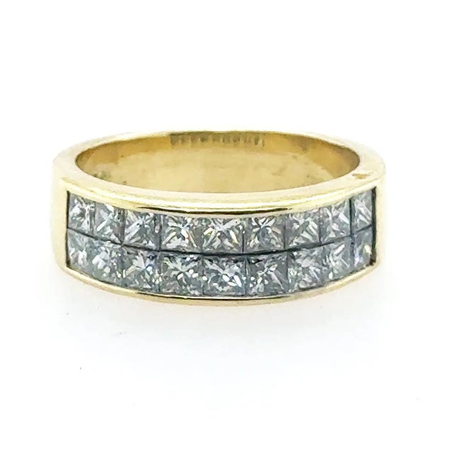 18k Yellow gold Quadra ring with 18 invisibly set princess cut diamonds weighinh 1.53. Numbered #16694, 6.01g Size 5.5
