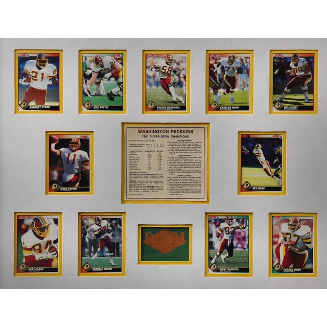 Framed commemorative display celebrating the Washington Redskins’ 1991 championship season and victory in Super Bowl XXVI...