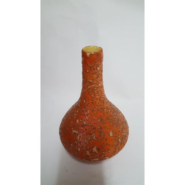Modern-styled, orange ceramic vase made in the 1970s. It can be a perfect piece in a modern or a vintage interior....