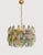 Multicolored Murano glass chandelier featuring a composition of polyhedron elements arranged on concentric levels. The...