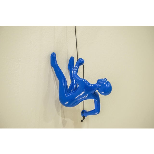 Our Vibrant Blue Climbing Man is a beautiful addition to your wall decor! Curate your own collection with our variety of...