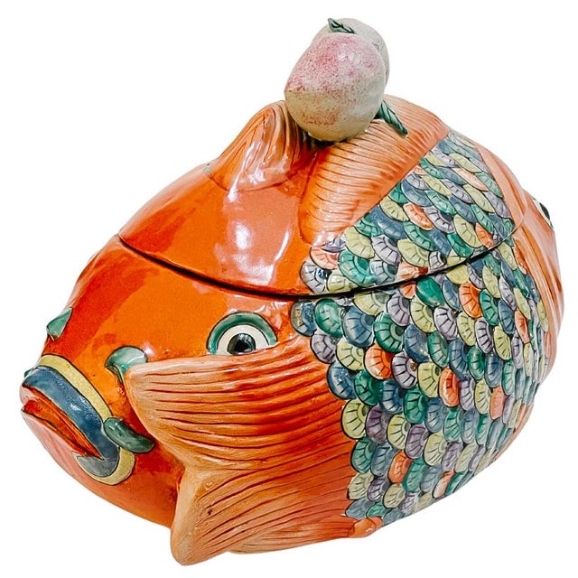 A fantastic Chinese export Famille Rose ceramic tureen in the form of a beautiful swimming koi fish with two heads. Hand-...