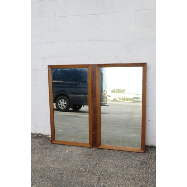 This gorgeous Mirror is made of wood, veneer, and mirror. We believe the Mirror was made by Fancher Furniture, it is not...