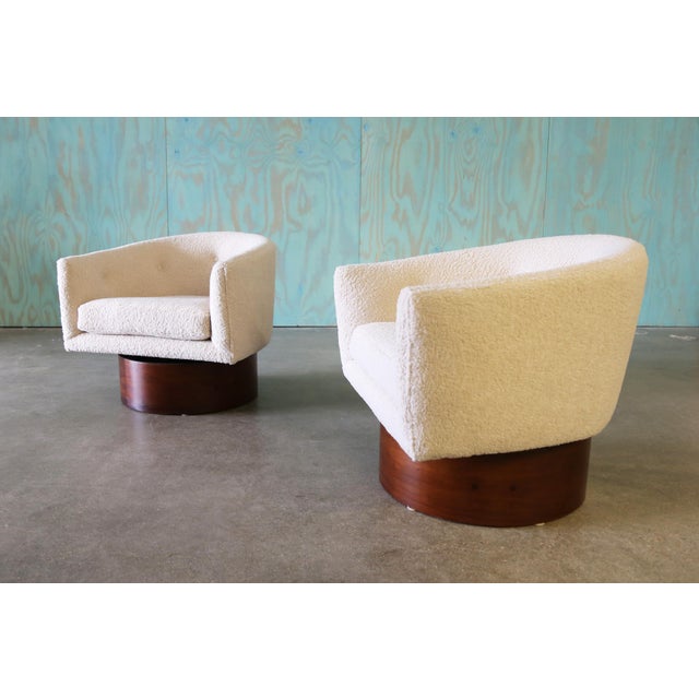 A pair of 1960s swivel tub chairs designed by Milo Baughman for Thayer Coggin. A sculptural set with swooping arms and...