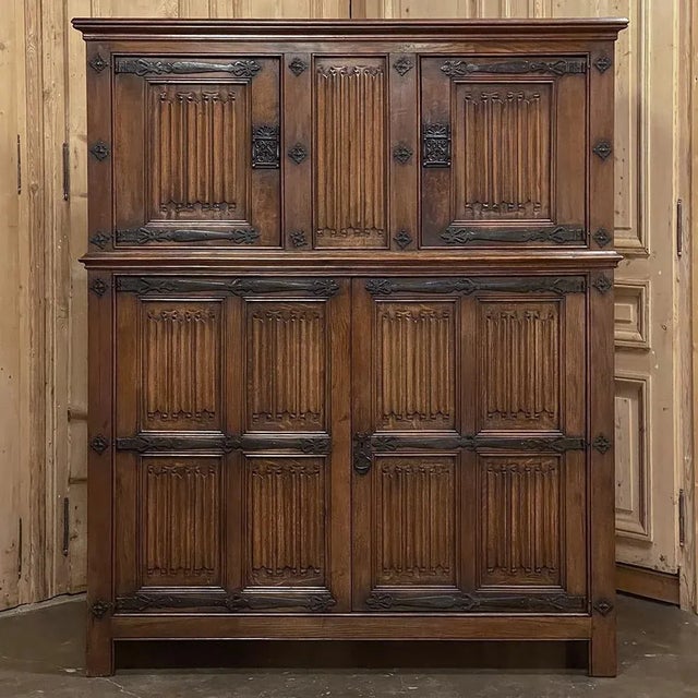 Antique French Gothic Wardrobe ~ Cabinet is an intriguing example of the style, with no less than 23 hand-carved linenfold...