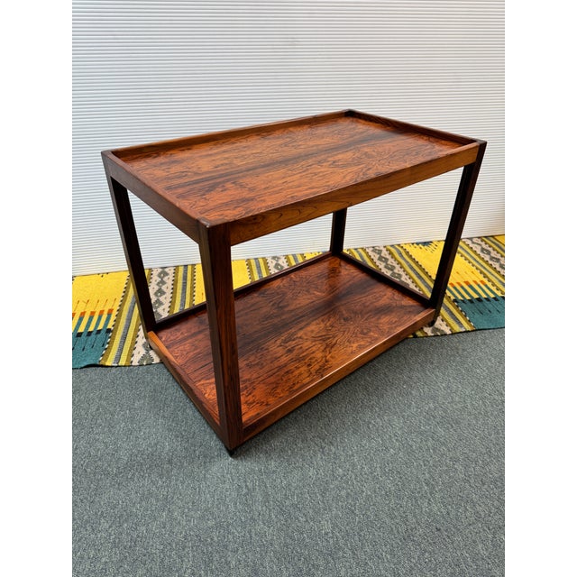 Design Plus Gallery presents a Vintage Bi-Level Trolley in Rosewood. The cart shows a beautiful wood grain with an...