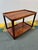 Design Plus Gallery presents a Vintage Bi-Level Trolley in Rosewood. The cart shows a beautiful wood grain with an...
