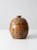 A vintage studio pottery jar signed by artist S. Miller, featuring a rounded, bulbous form, a tawny-brown glaze, and an...