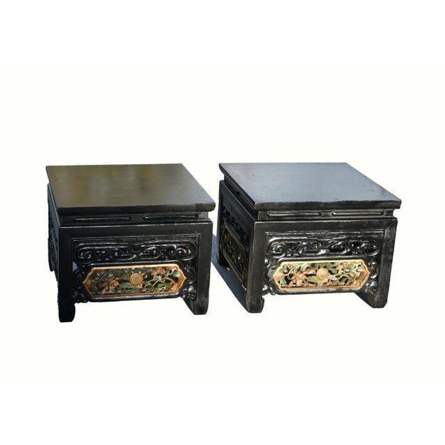 An exceptional offer of value on this pair of beautiful, fully carved solid wood low tables. Solid single board top...
