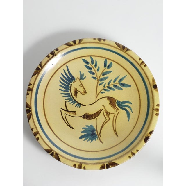 Kupittaan Savi Ceramic Wall Plate – Hand-Painted Finnish Art Pottery with Stylized Horse Motif A charming and highly...