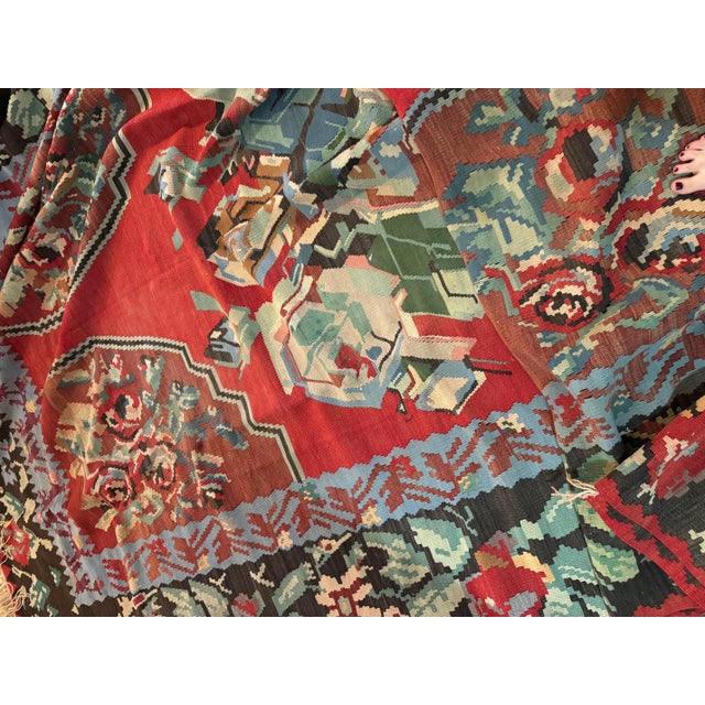 This is a lovely handwoven floral antique Bessarabian Kilim from Romania circa 1950s measuring 7.9 x 11.5 ft. These flat-...