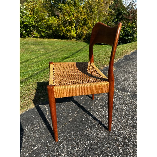 Good looking mid century style chair believe it’s teak wood with weave seat