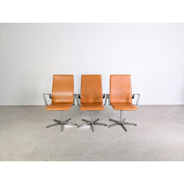 Beautiful set of three Fritz Hansen chairs for sale. Designed by Arne Jacobsen, one of the most influential designers of...