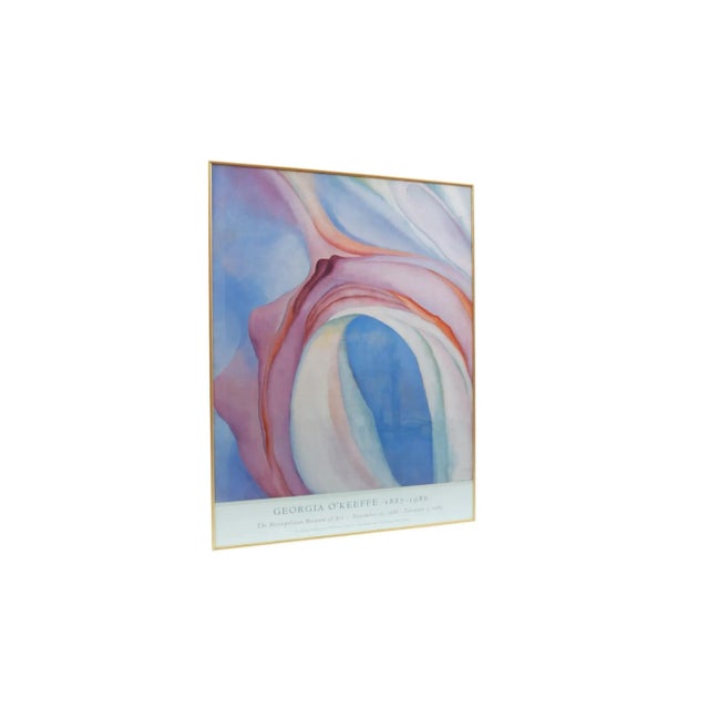 A framed giclee poster promoting an exhibition of works by American modernist painter Georgia O’Keefe (b.1887 – 1986) at...