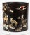 A dark, dense hardwood zitan with raised designs crafted from mother-of-pearl, shell, tinted bone or ivory, and semi-...