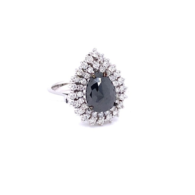 Stunning Pear Cut Black and White Diamond Bridal Ring Description as follows: Pear Cut Dia weighs 2.32 carats 43 Round Cut...