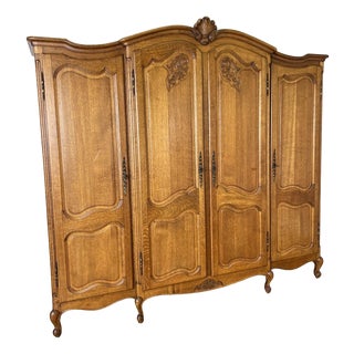 Vintage Louis XVI French Oak Four Door Carved Armoire For Sale