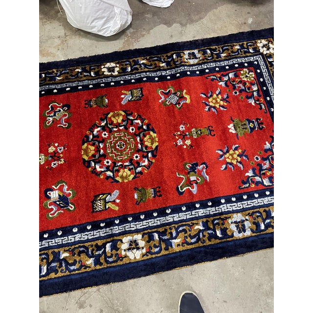 A vibrant handmade vintage Chinese Art Deco silk rug from the 1950s, featuring a bold red field enriched with elegant...
