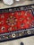 A vibrant handmade vintage Chinese Art Deco silk rug from the 1950s, featuring a bold red field enriched with elegant...
