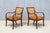 This rare pair of armchairs was designed and produced by Frits Henningsen in Denmark in the early 1930s. The frames are...