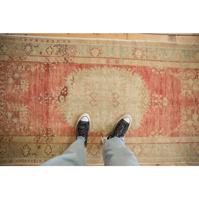 :: Roundel center medallion with detailed Rococo stylized finishing adorned at either side by blossomed finials atop a...