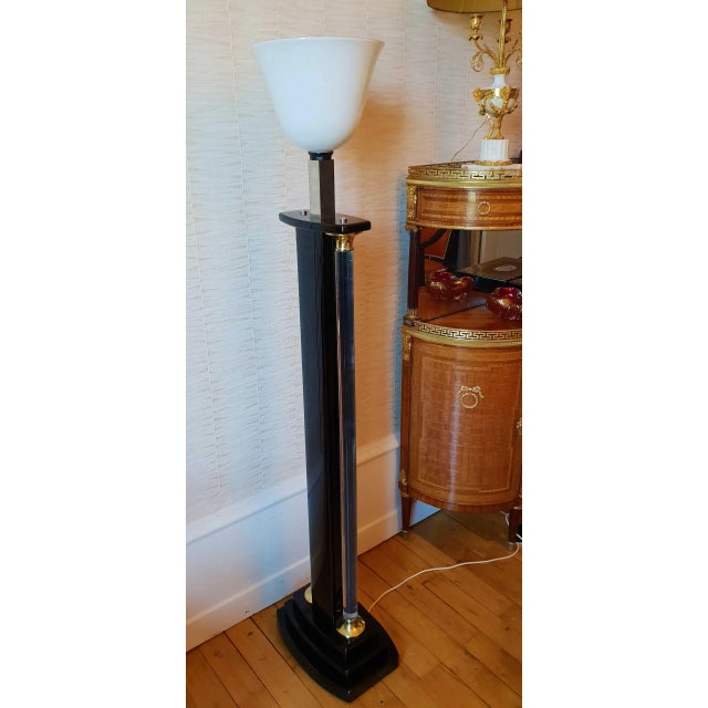 Lamp in black lacquer, brass, and Lucite with an opaline diffuser. Designed by Jean Claude Mahey in the 70s. This piece is...