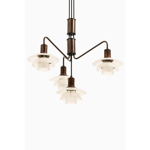 Ceiling lamp in browned brass frame, glass shades by poul henningsen, 1931-1937 additional information: material: browned...