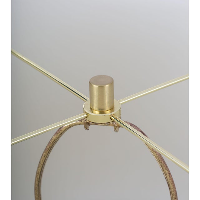 Clean lines and elemental materials lend an iconic quality to the Grace alabaster table lamp. Featuring natural brass...