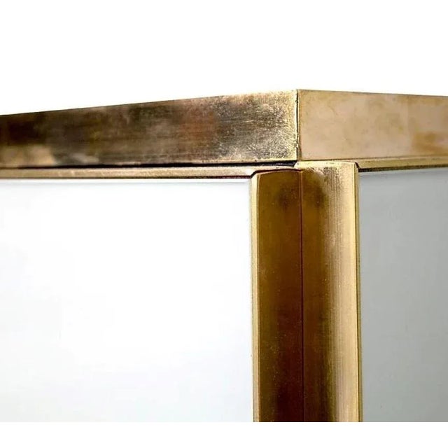 Outstanding pair of modern white Murano glass cabinets with brass trim. These create a very high end polished look and the...