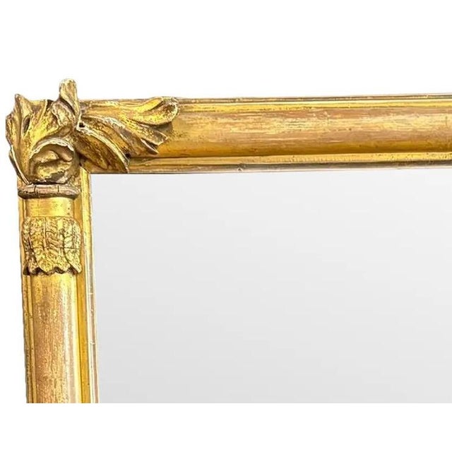 Antique 19th Century French Empire Giltwood Gesso Mantel Mirror with Foxed Glass This authentic 19th-century French Empire...