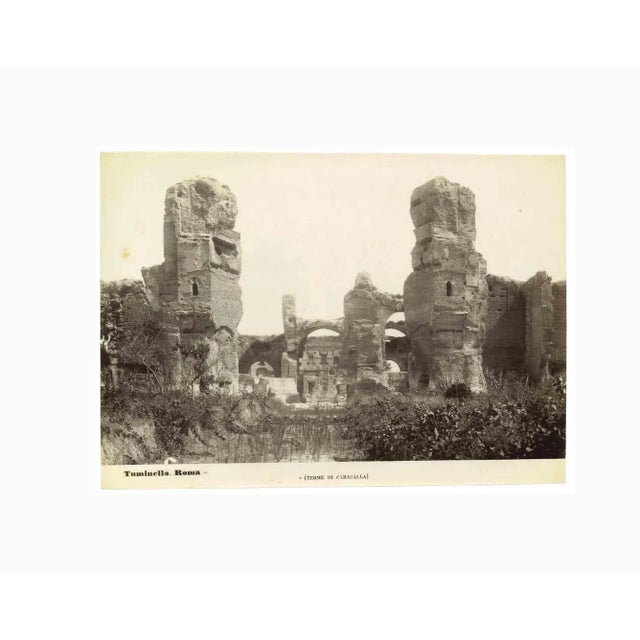 Baths of Caracalla is a vintage black and white photograph realized by an anonymous artist in the 20th Century. Good...