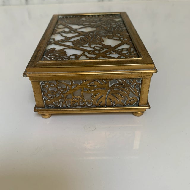 This Tiffany box has small rounded feet and classic design that makes it a lovely tabletop accessory. It is signed Tiffany...
