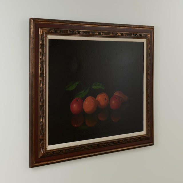 Striking still life oil painting on canvas of fruit and leaves in a mysterious dark background, executed in a hyper...