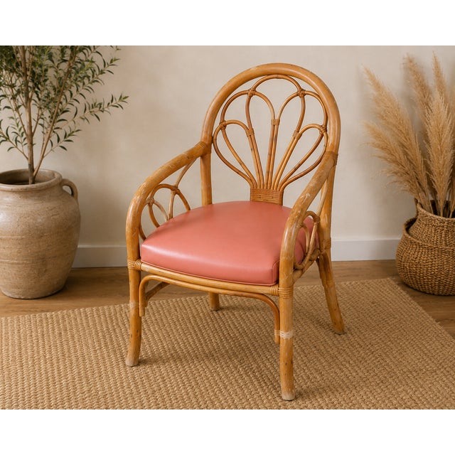 Vintage Rattan Petal Fan-Back Armchairs with Coral Pink Cushions — Pair Description: A striking pair of vintage rattan...