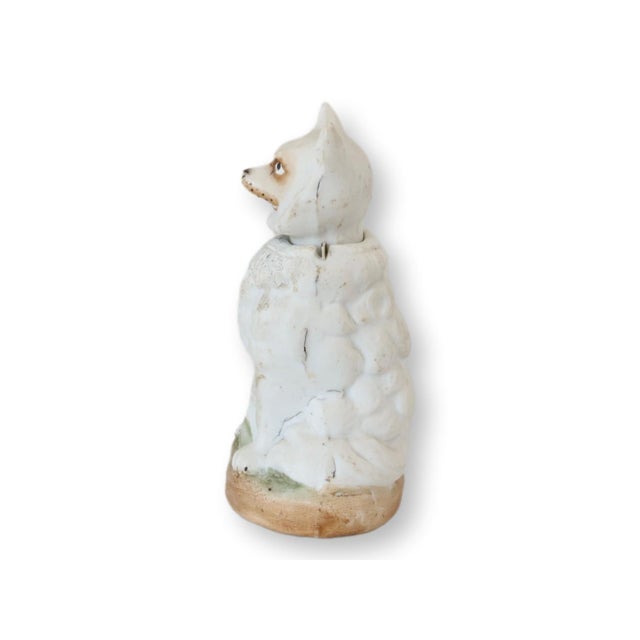 Late 19th century German porcelain figural group depicting a pug seated beside a larger Pomeranian whose head gently nods...