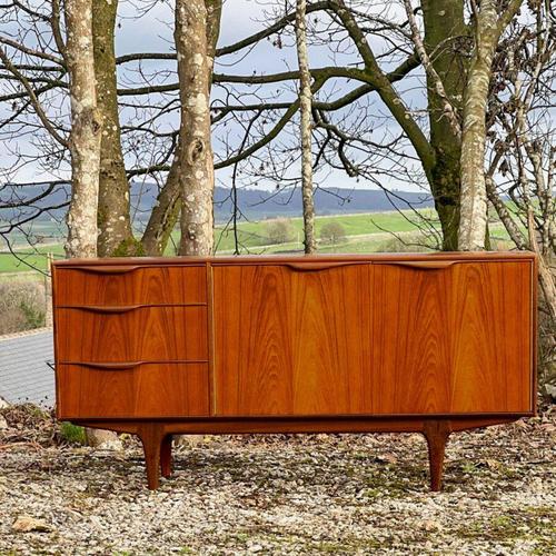 This elegant small sideboard, designed by Tom Robertson in the 1960s in Scotland , epitomizes the refined craftsmanship of...