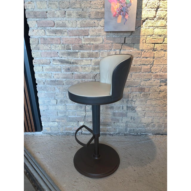 Used Giorgetti Chi Wing Lo Leather Bar Stool. Leather is beige on seat and the back is dark taupe color. With dark brown...
